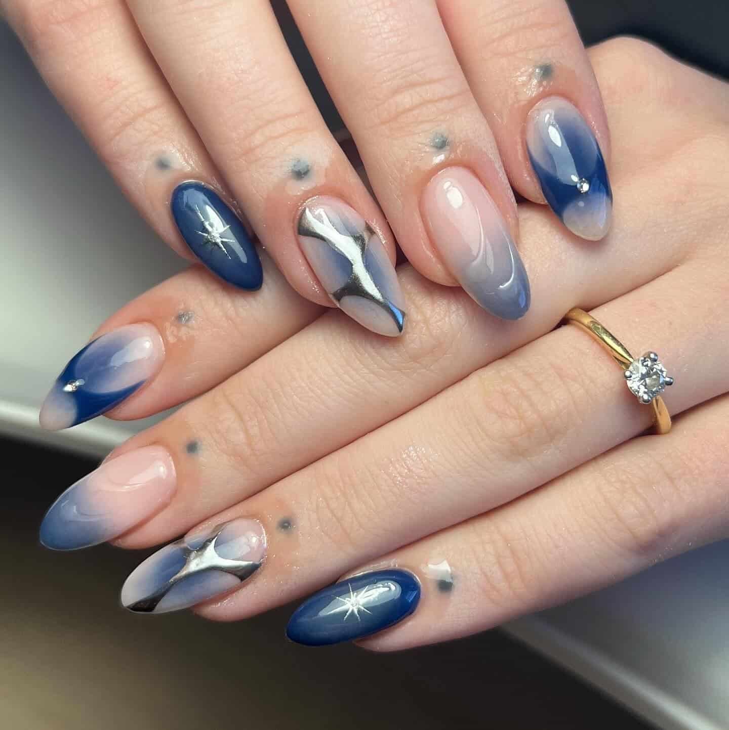 22. Midnight Fade Starlight Nails - silver and blue nail ideas