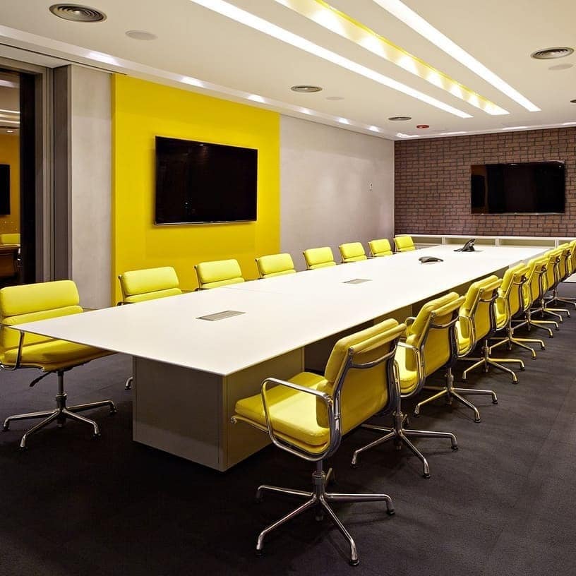 5. Executive Glow Boardroom - yellow office ideas