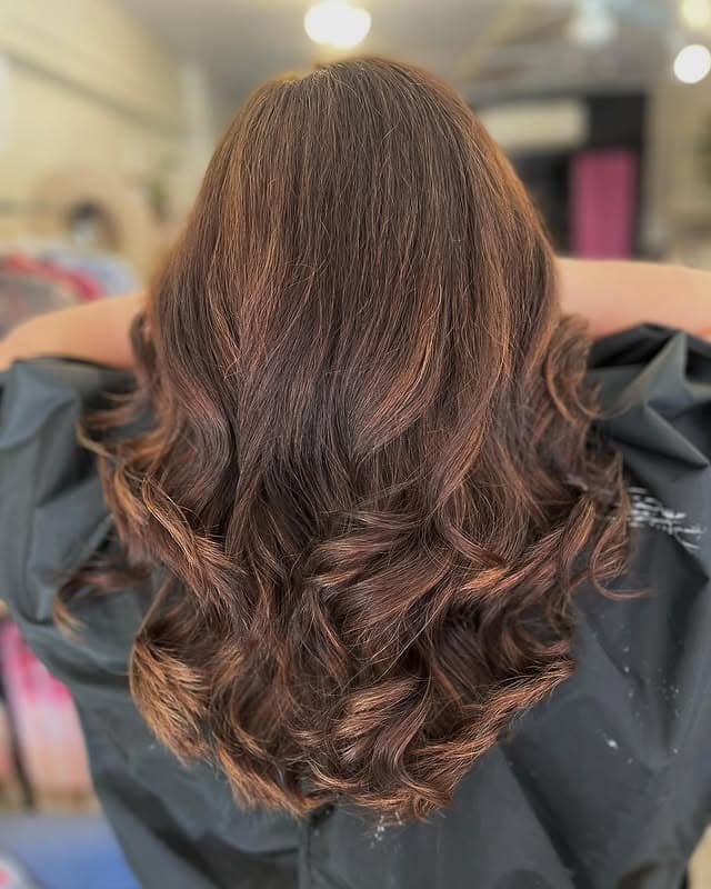 1. Soft Chestnut Waves with Subtle Dimension - Chestnut Hair Color