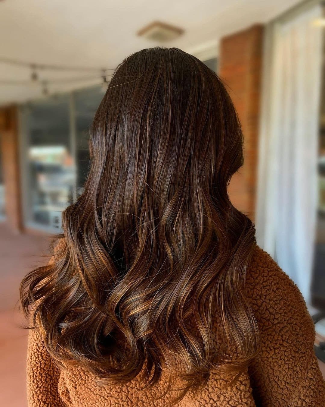 7. Glossy Chestnut Brown with Caramel Threads - Chestnut Hair Color