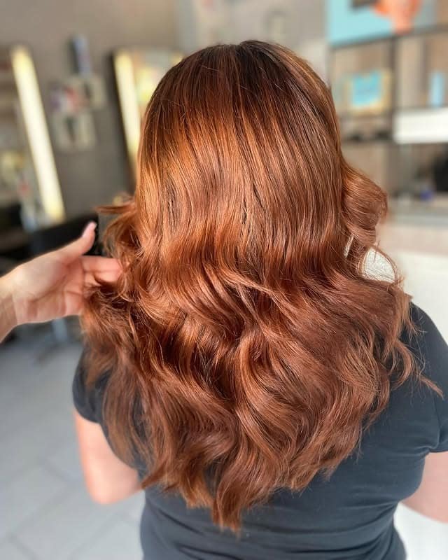 11. Golden Chestnut Waves with Luminous Warmth - Chestnut Hair Color