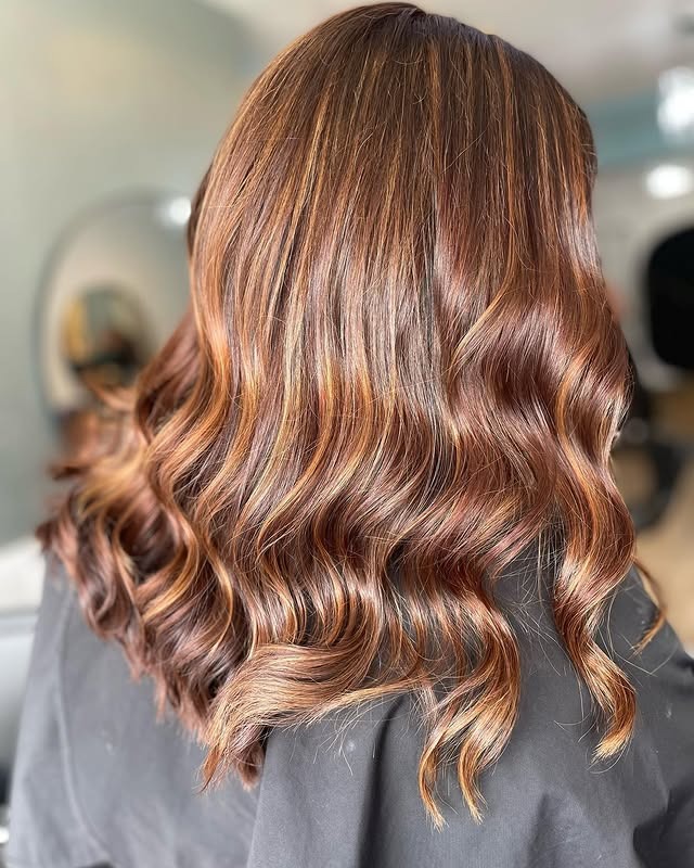 19. Honey-Chestnut Blend with Seamless Waves - Chestnut Hair Color