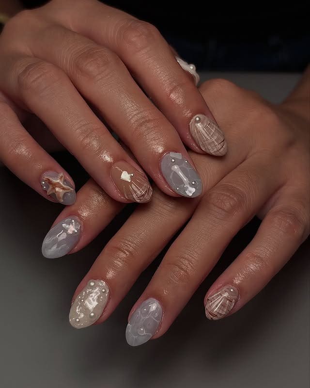 2. Sandy Shell Elegance - simple beach nail ideas