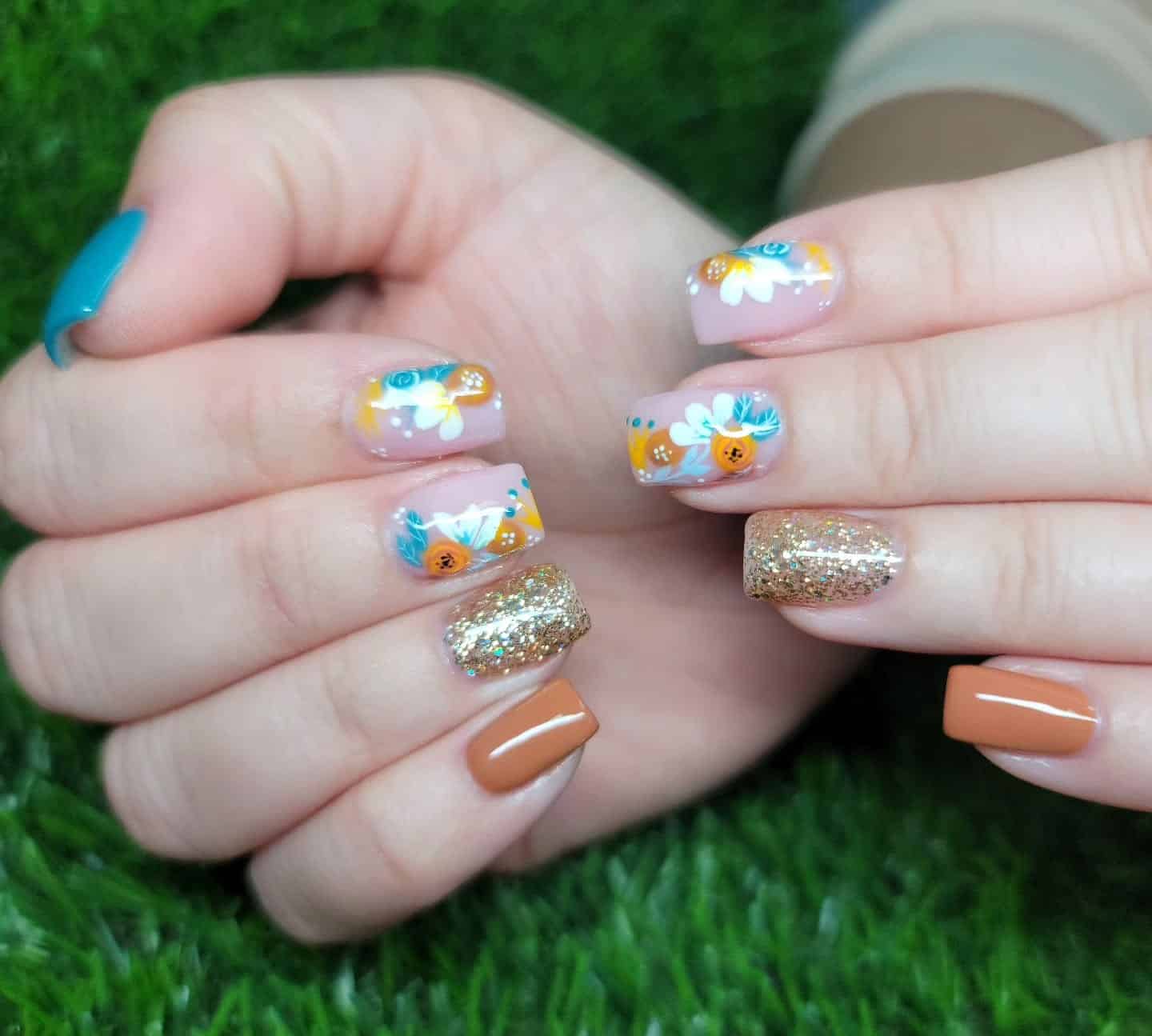 9. Golden Beach Garden - simple beach nail ideas