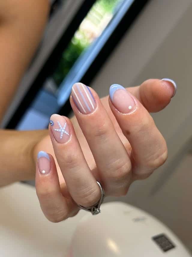 17. Coastal Stripes & Starfish - simple beach nail ideas