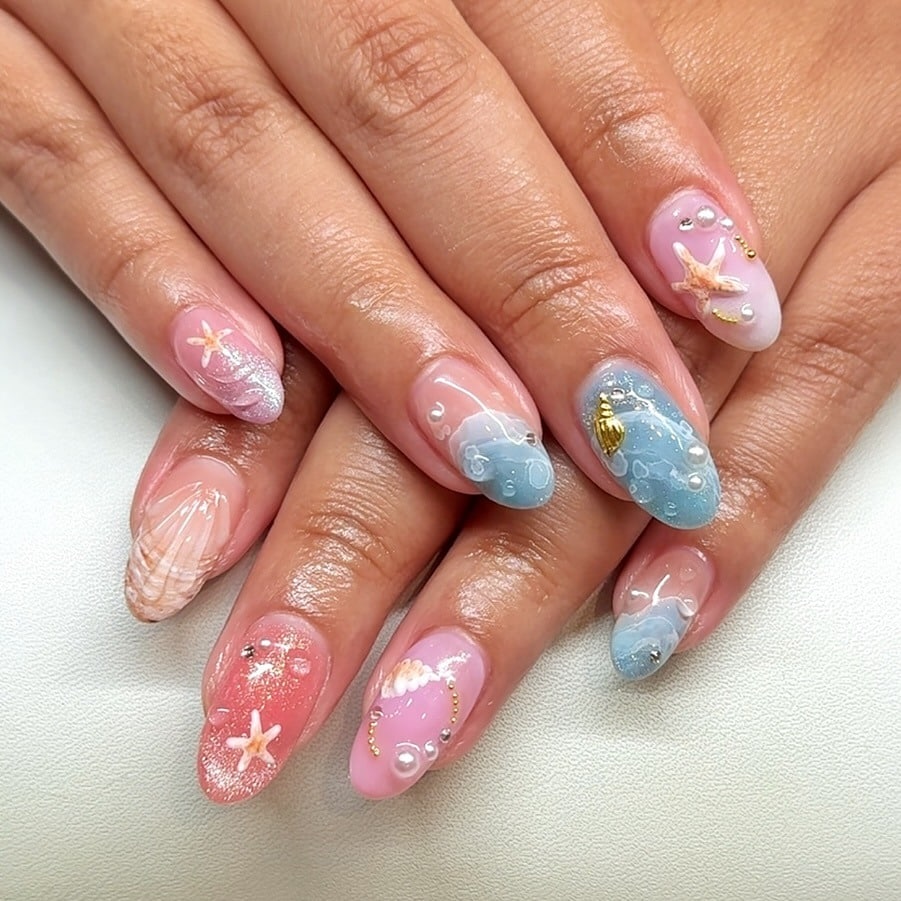 19. Seashell Glow Nails - simple beach nail ideas