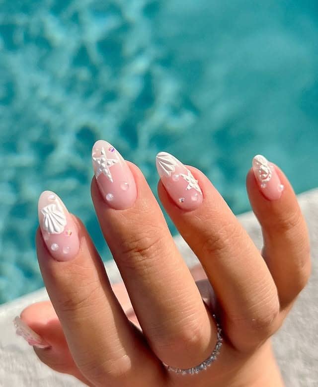 21. Shell Kissed Elegance - simple beach nail ideas
