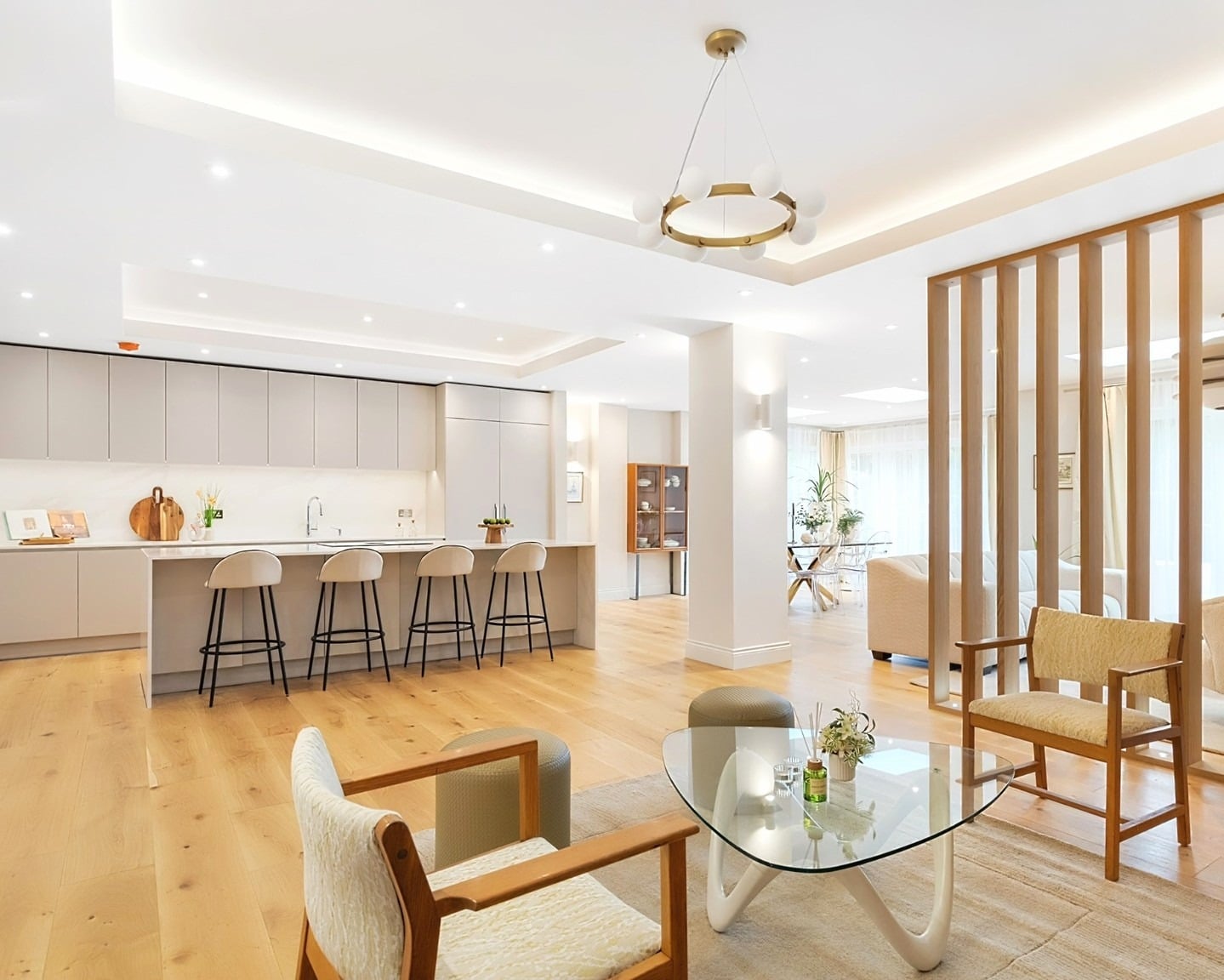 3. Open-Concept Light Oak Harmony - kitchen and living room divider ideas