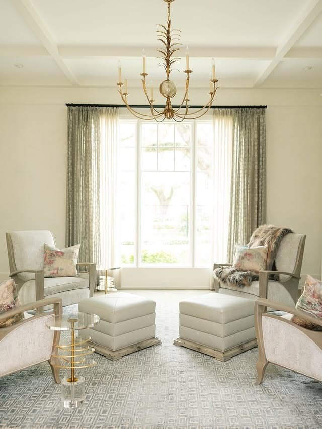 21. Graceful Symmetry in Soft Gold and Ivory - living room chandelier ideas