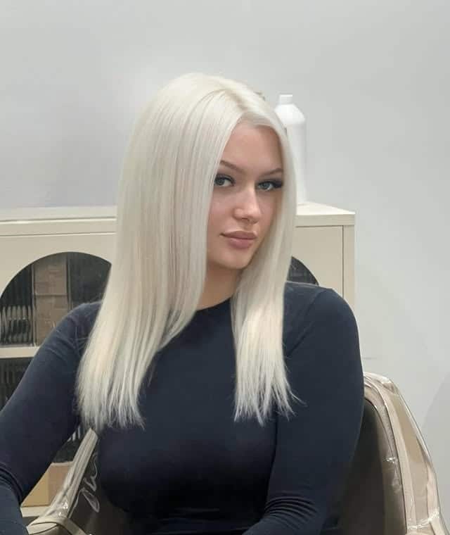 20. Polished Platinum Straight Cut - Platinum Blonde Hair