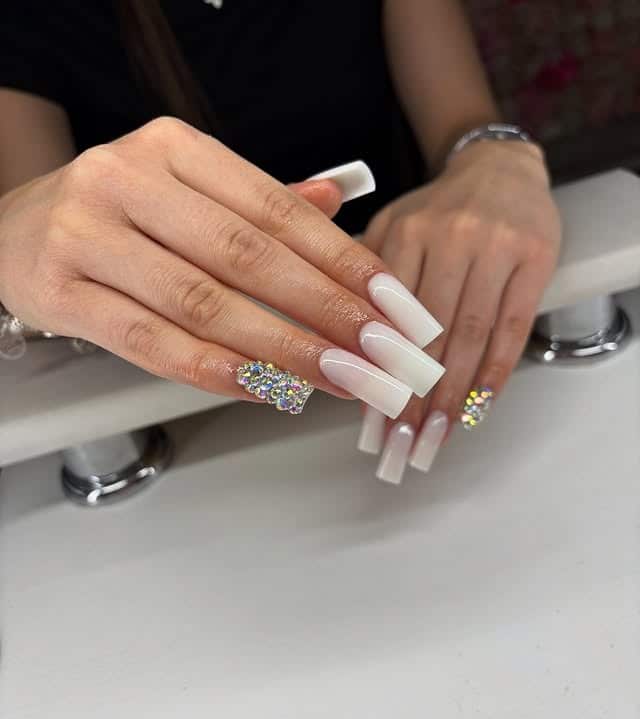 1. Classic White Ombré Elegance with Crystal Accent - simple diamond nail ideas