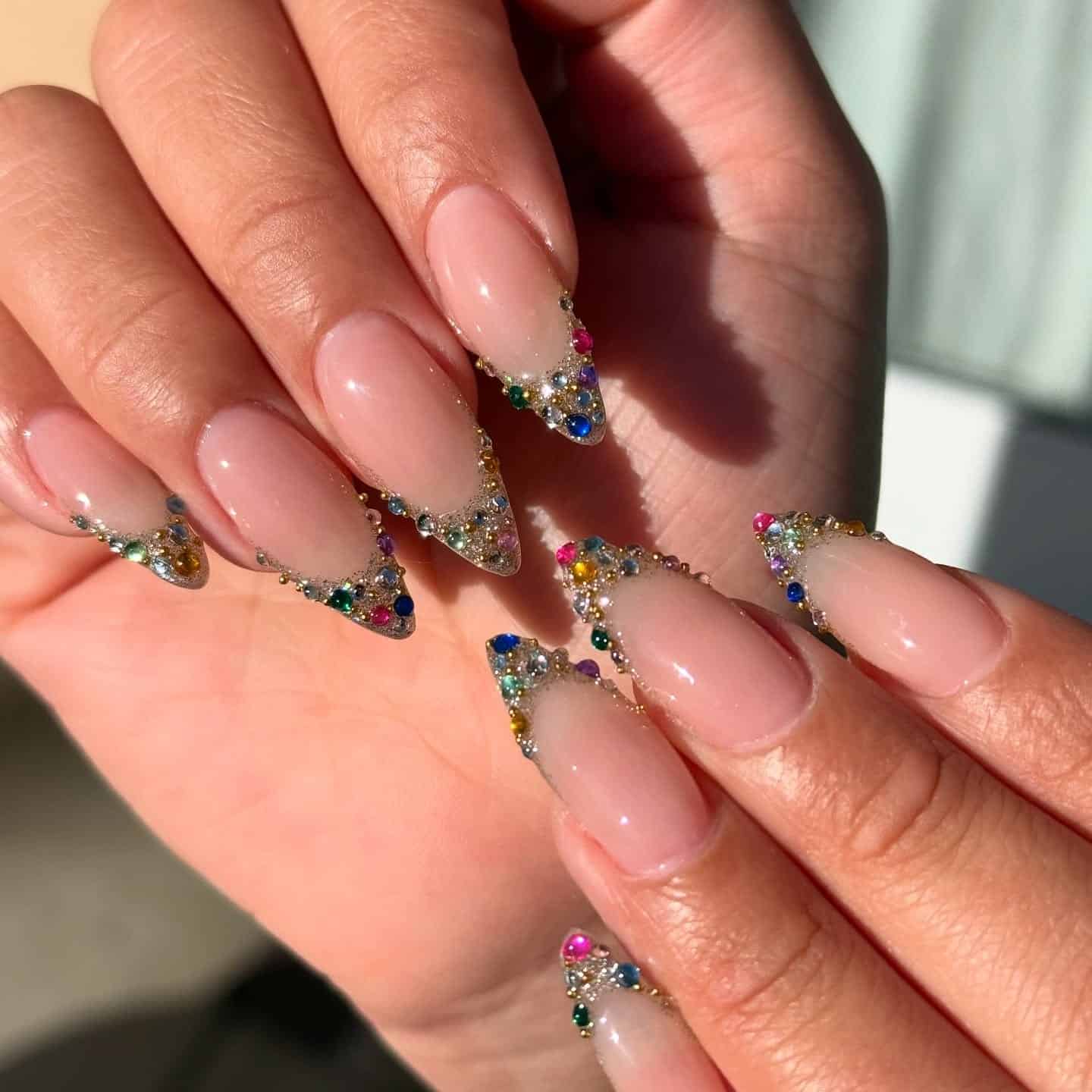 6. Vibrant Crystal-Tipped Almond Nails - simple diamond nail ideas