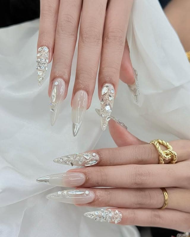 10. High Shine Silver Stiletto Nails with Dior Detail - simple diamond nail ideas