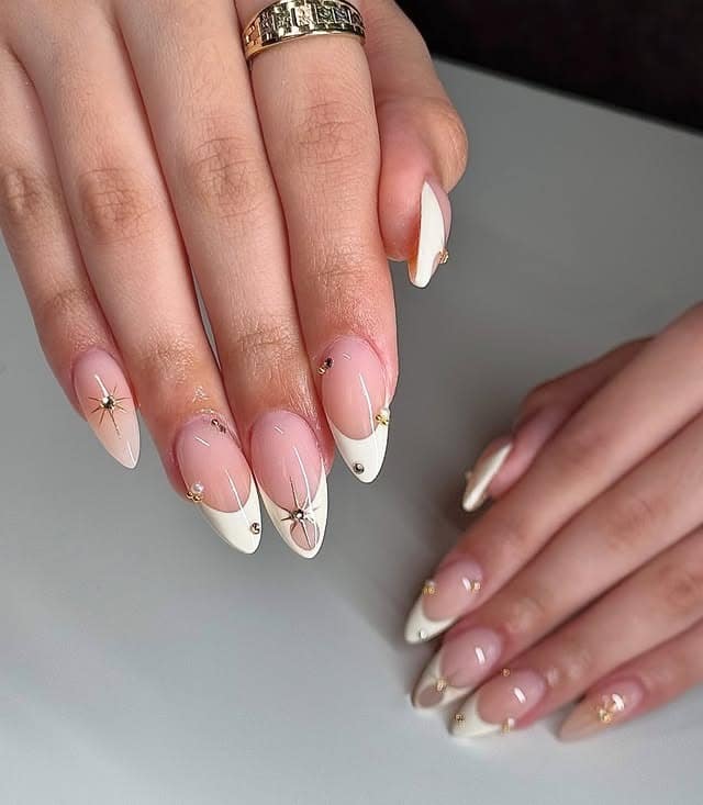 11. Ivory Starburst French with Gold Accents - simple diamond nail ideas