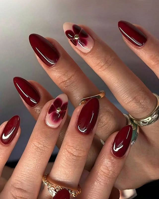 16. Deep Cherry Gloss with Petal Accent Art - simple diamond nail ideas