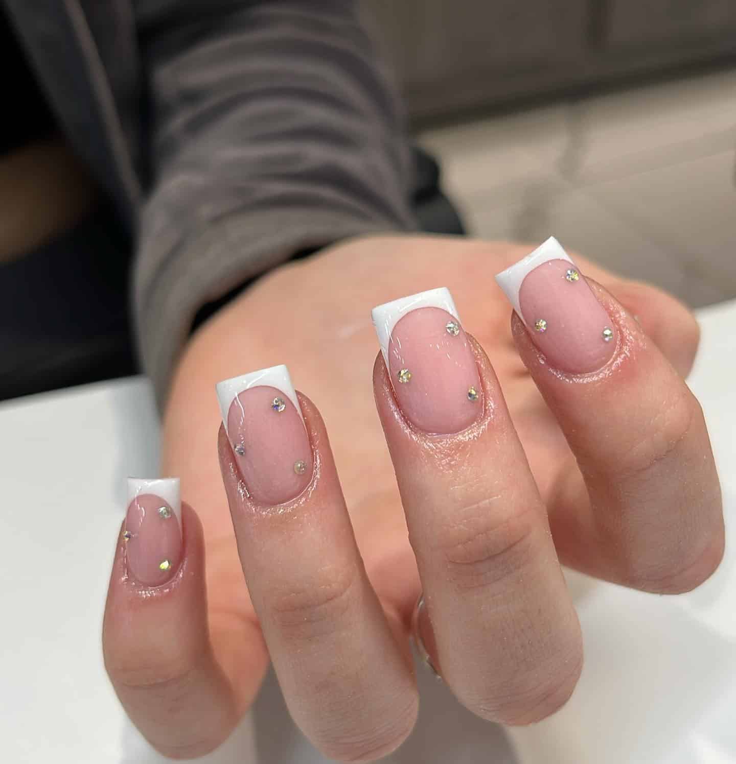 20. Minimalist White French with Subtle Diamond Dust - simple diamond nail ideas