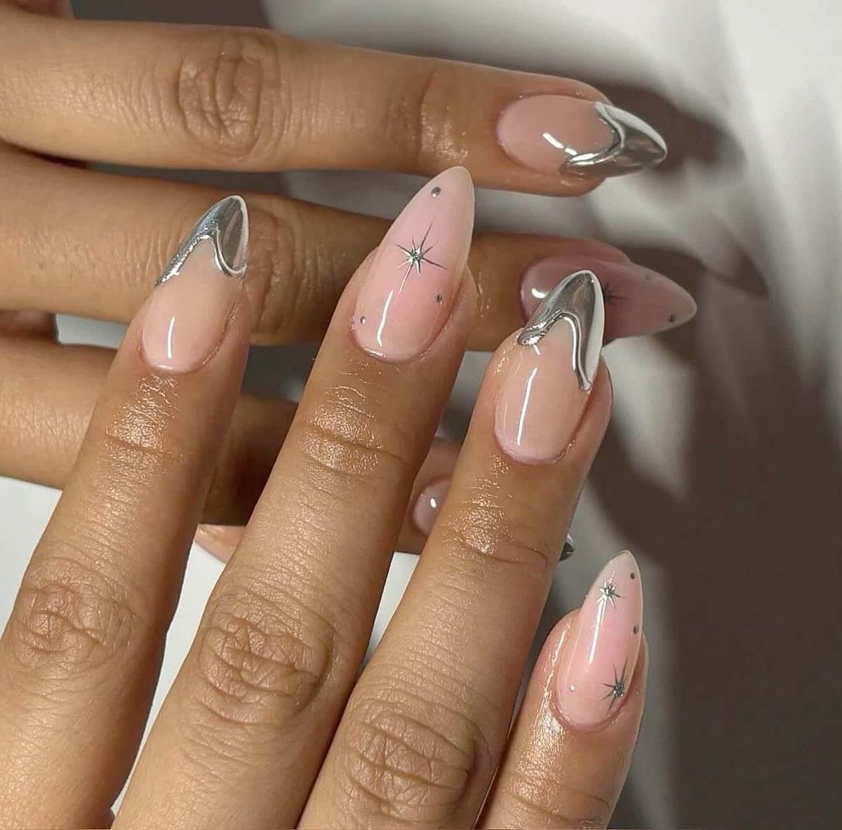 21. Chrome Wave Almond Nails with Star Detailing - simple diamond nail ideas