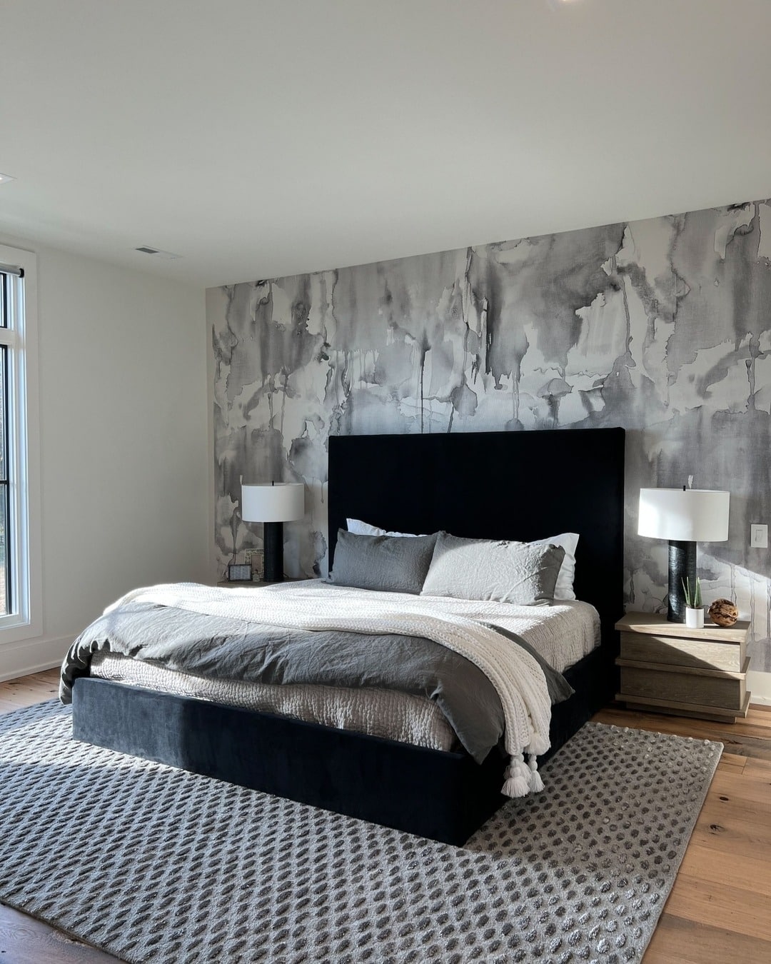 4. Marble-Washed Wall with Graphite Accents - grayscale bedroom ideas
