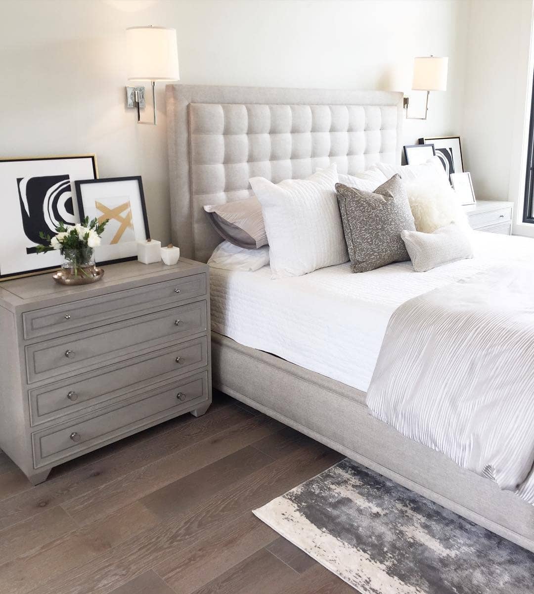 16. Light Gray Monochrome Bedroom with Soft Artwork - gray, black and white bedroom ideas