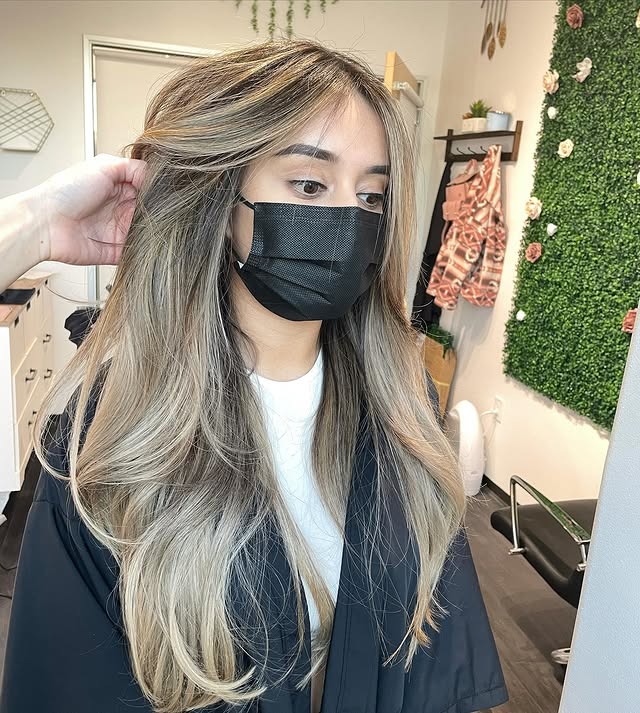 2. Dimensional Sandy Blonde with Long Blended Waves - Sandy Blonde Hair Color