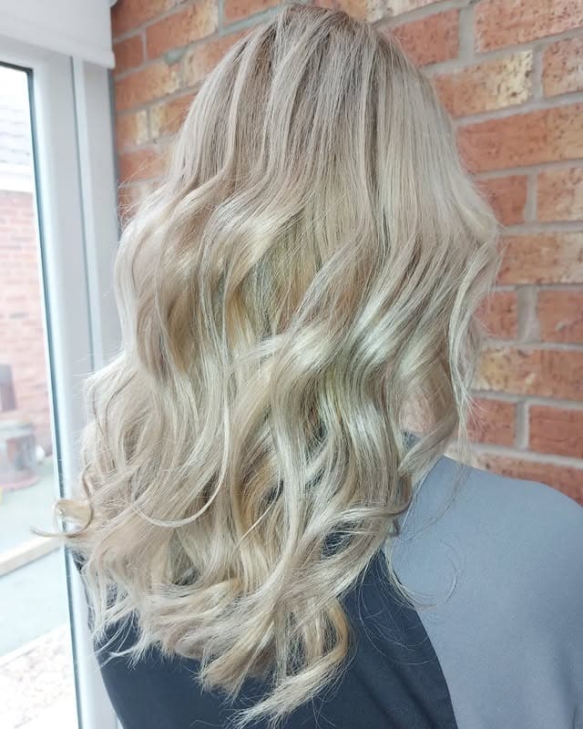 3. Light Sandy Blonde with Loose Mid-Length Waves - Sandy Blonde Hair Color