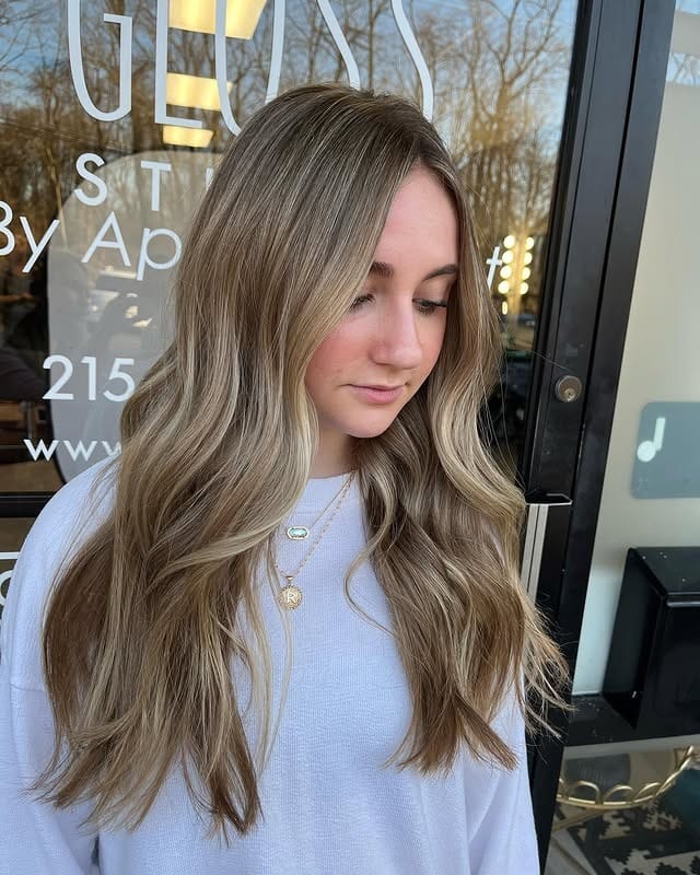 19. Natural Sandy Mushroom Blonde with Loose Waves - Sandy Blonde Hair Color