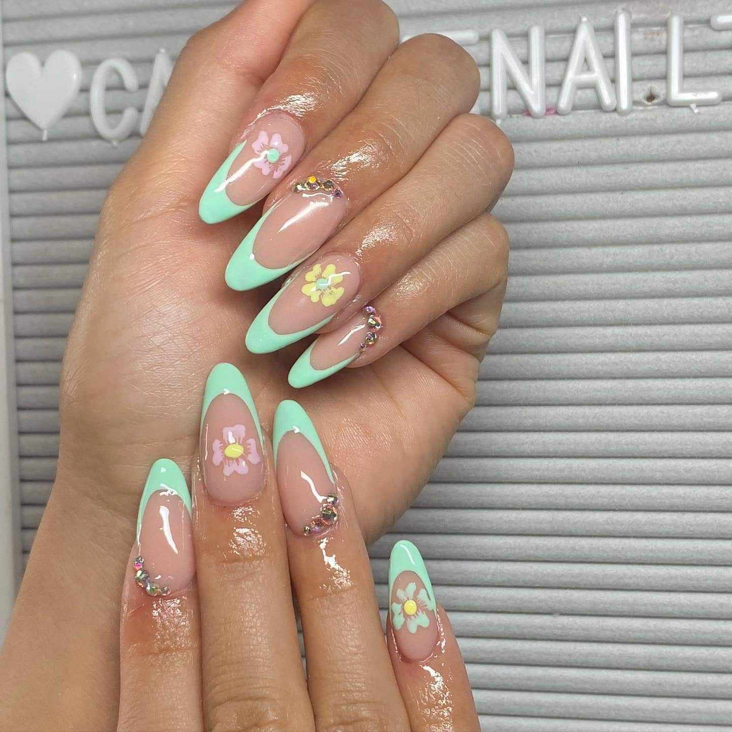 6. Mint French Almond Nails with Yellow & Pink Spring Flowers - spring almond nail ideas