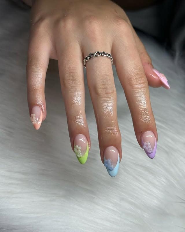 9. Pastel French Almond Nails with Petite Floral Charms - spring almond nail ideas