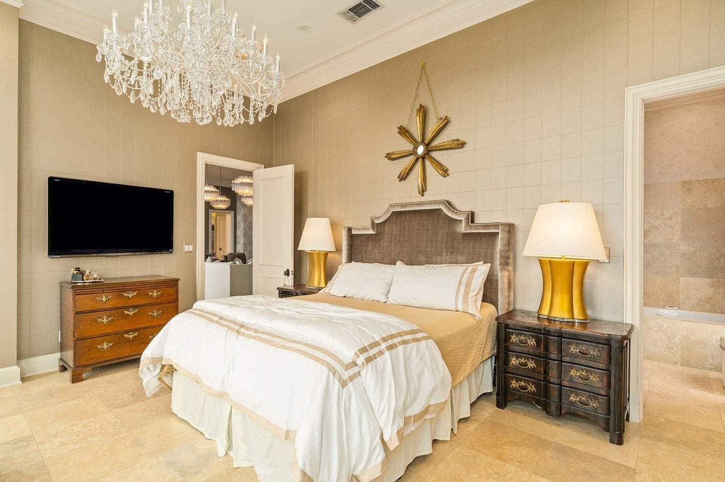 3. Elegant Gold-Accented Bedroom With Classic Detailing - apartment bedroom ideas