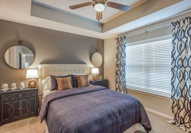 8. Contemporary Gray Bedroom With Patterned Drapery - apartment bedroom ideas