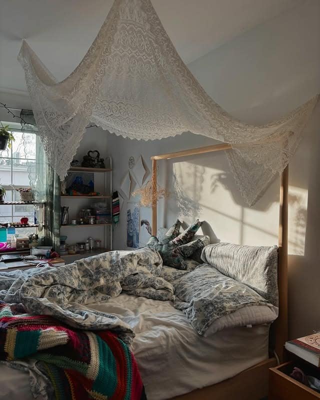 9. Boho Bedroom With Lace Canopy and Mixed Patterns - apartment bedroom ideas