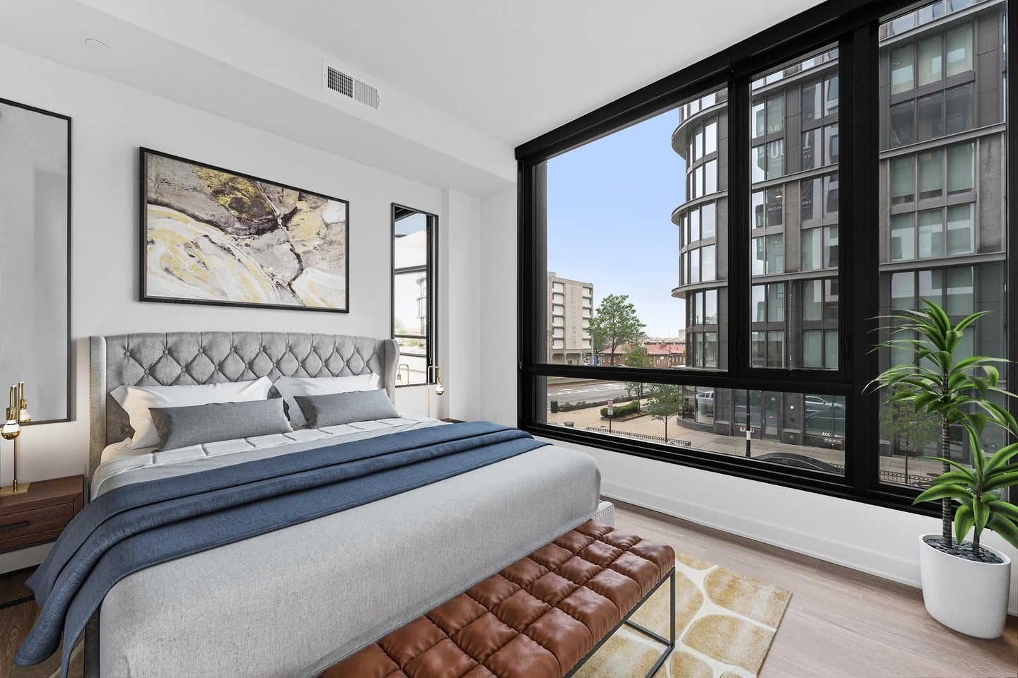 13. Urban Gray Bedroom With a City View - apartment bedroom ideas