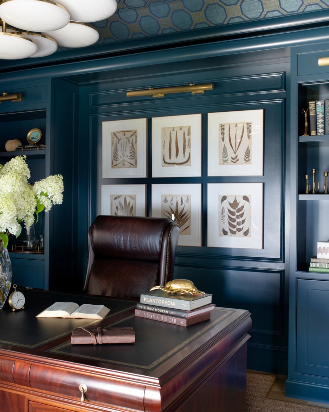 9. Ink Blue Study with Polished Wood Desk - paint colors for office ideas