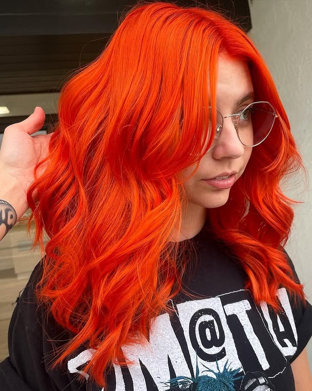 4. Bright Flame Orange Mid-Length Waves - Orange Hair Color