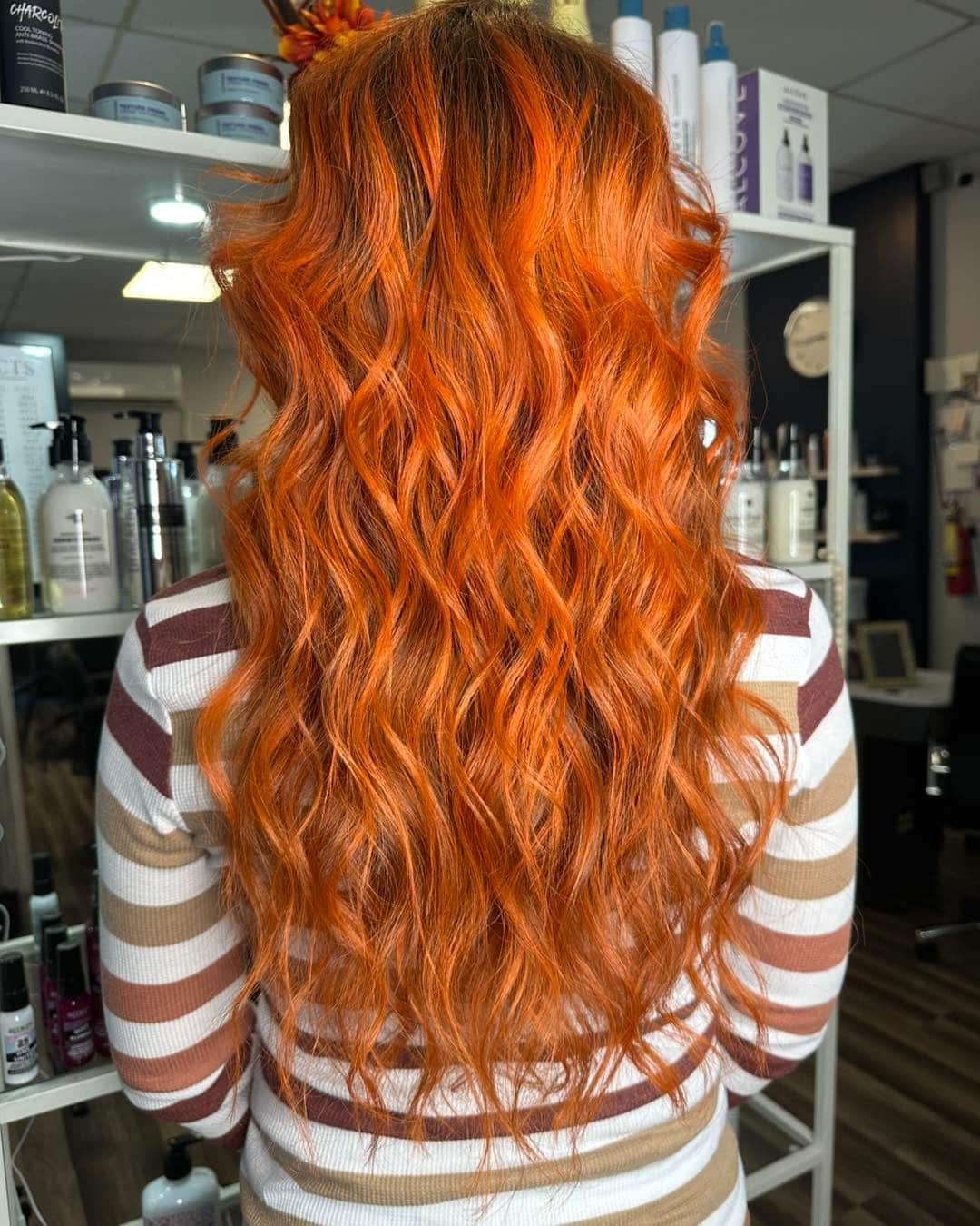 7. Long Textured Copper-Citrus Waves - Orange Hair Color