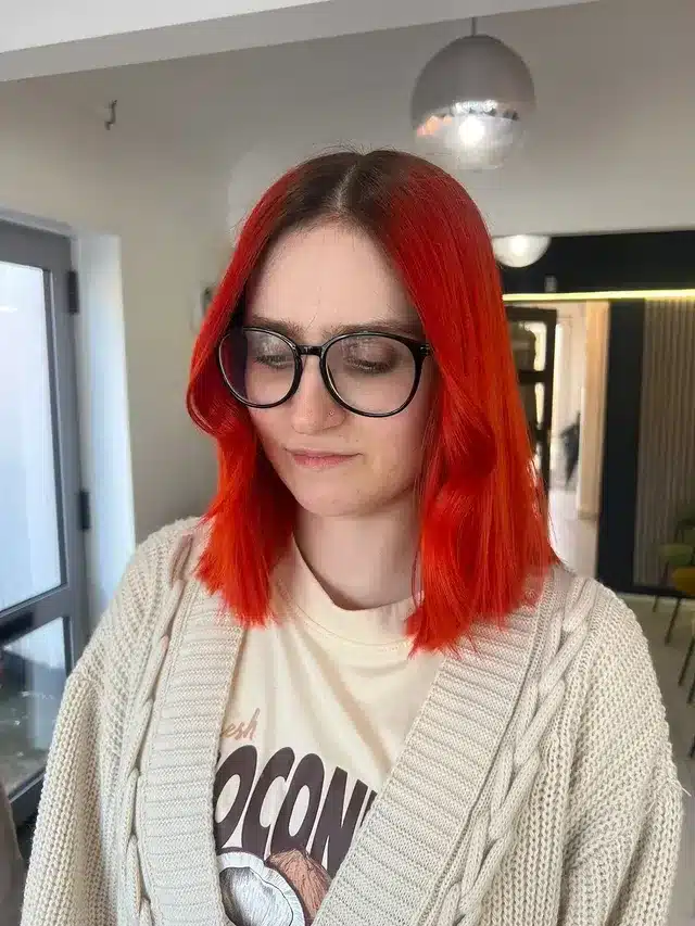 9. Vibrant Orange Lob with Dark Root Contrast - Orange Hair Color