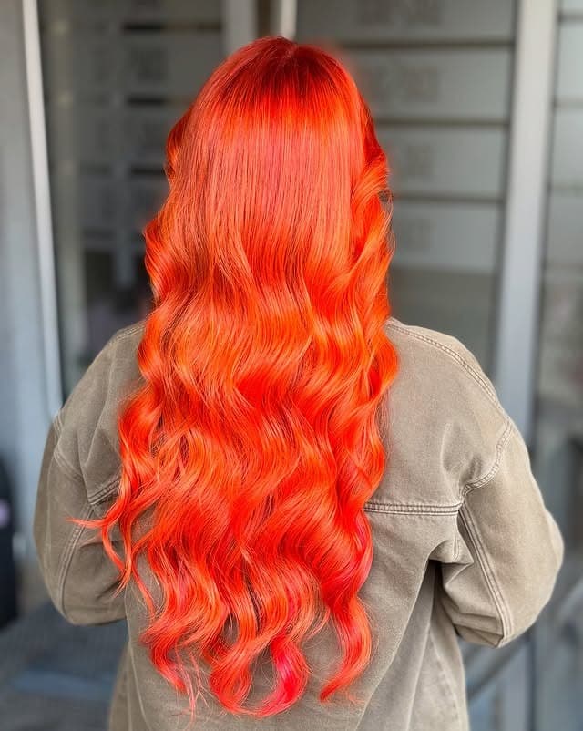 10. Radiant Orange Hollywood Waves - Orange Hair Color