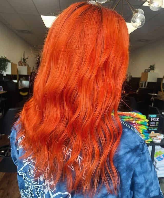 22. Bright Neon Orange Soft Waves - Orange Hair Color