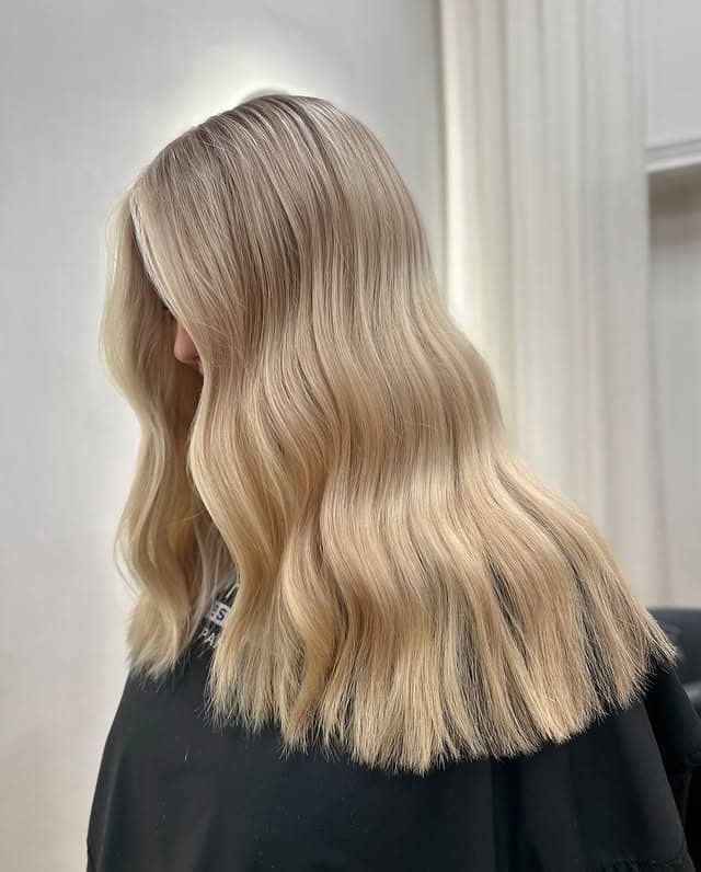 1. Soft Dark Blonde Waves with Seamless Highlights - Dark Blonde Hair Color with Highlights