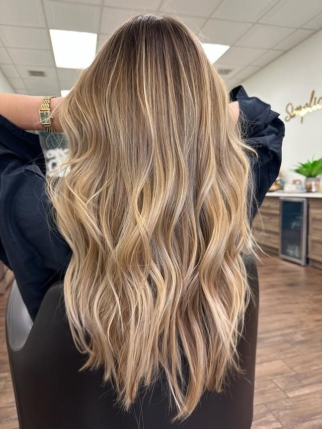 5. Textured Dark Blonde Layers with Sunlit Highlights - Dark Blonde Hair Color with Highlights