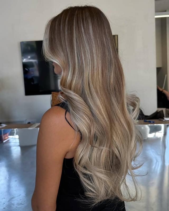 16. Long Dark Blonde Contour Waves with Face-Framing Accents - Dark Blonde Hair Color with Highlights