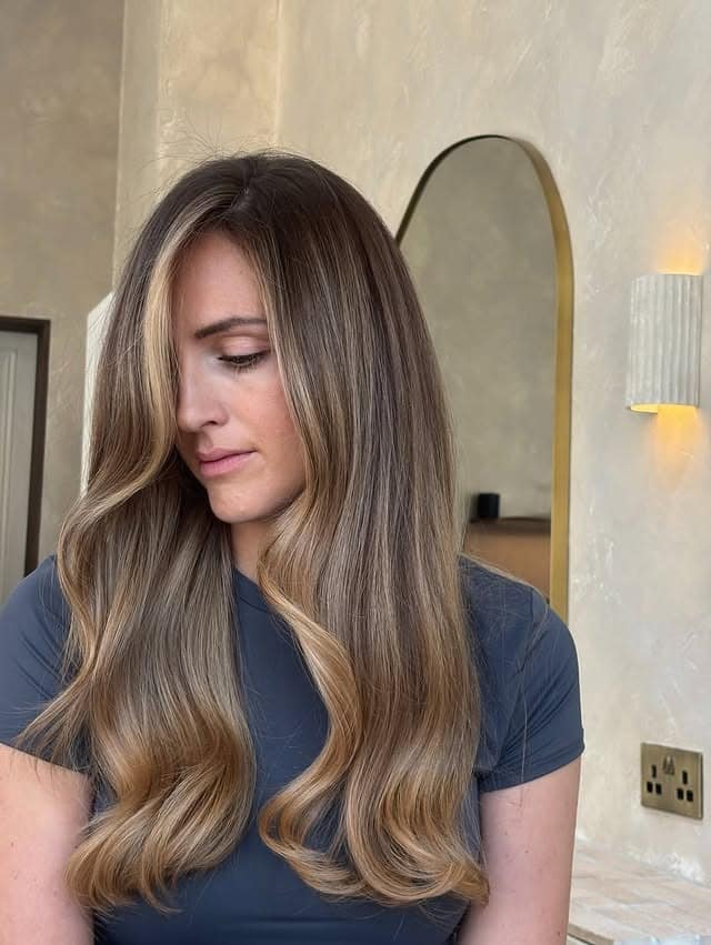 20. Smooth Dark Blonde Balayage with Classic Draped Waves - Dark Blonde Hair Color with Highlights