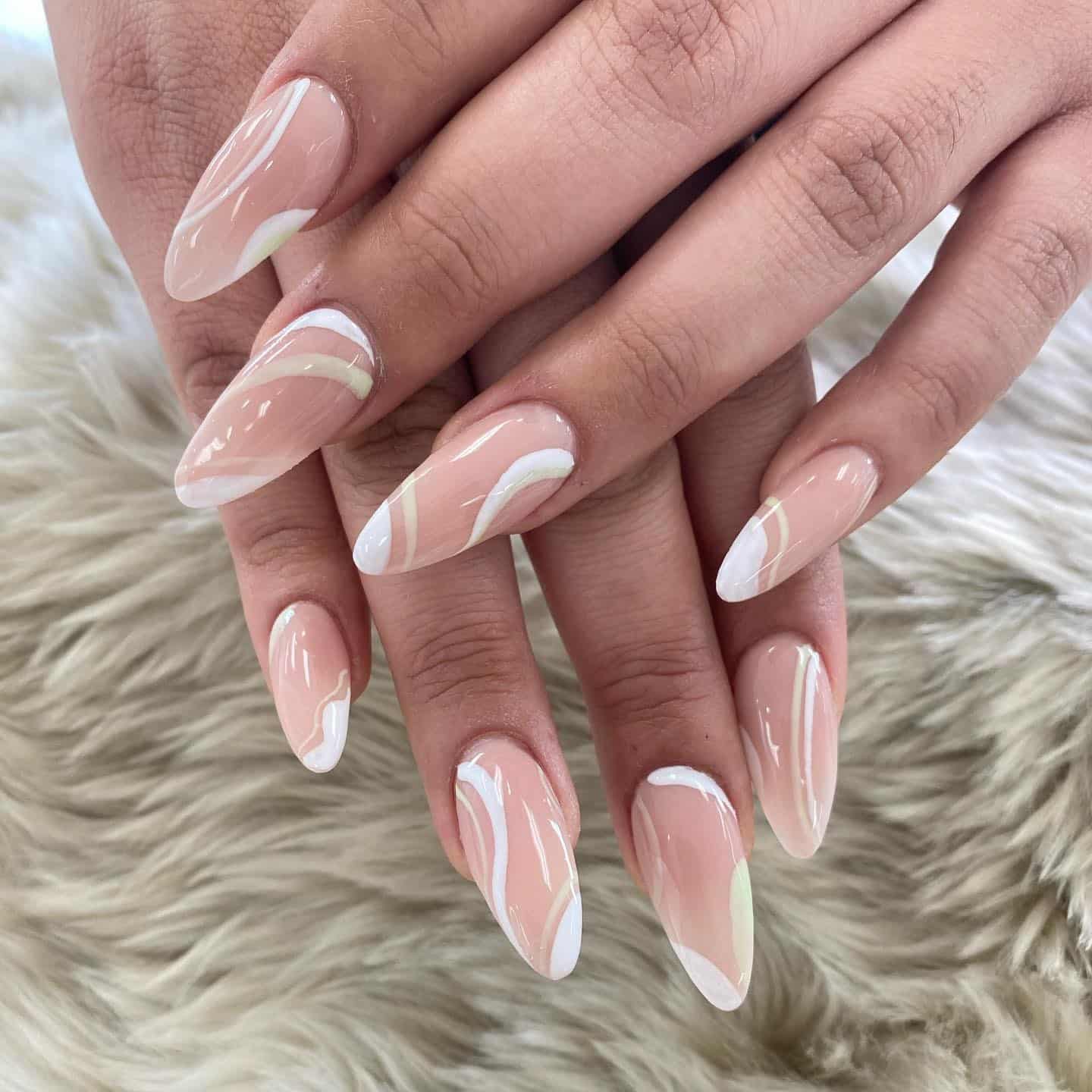 1. Soft Nude Waves with White Accents - squiggly nail ideas
