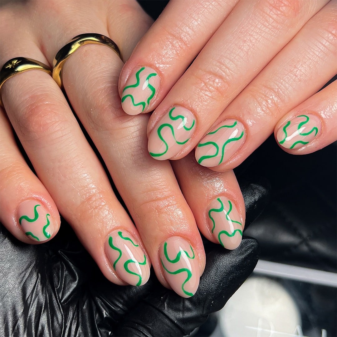 9. Fresh Green Curves on Natural Sheer Base - squiggly nail ideas