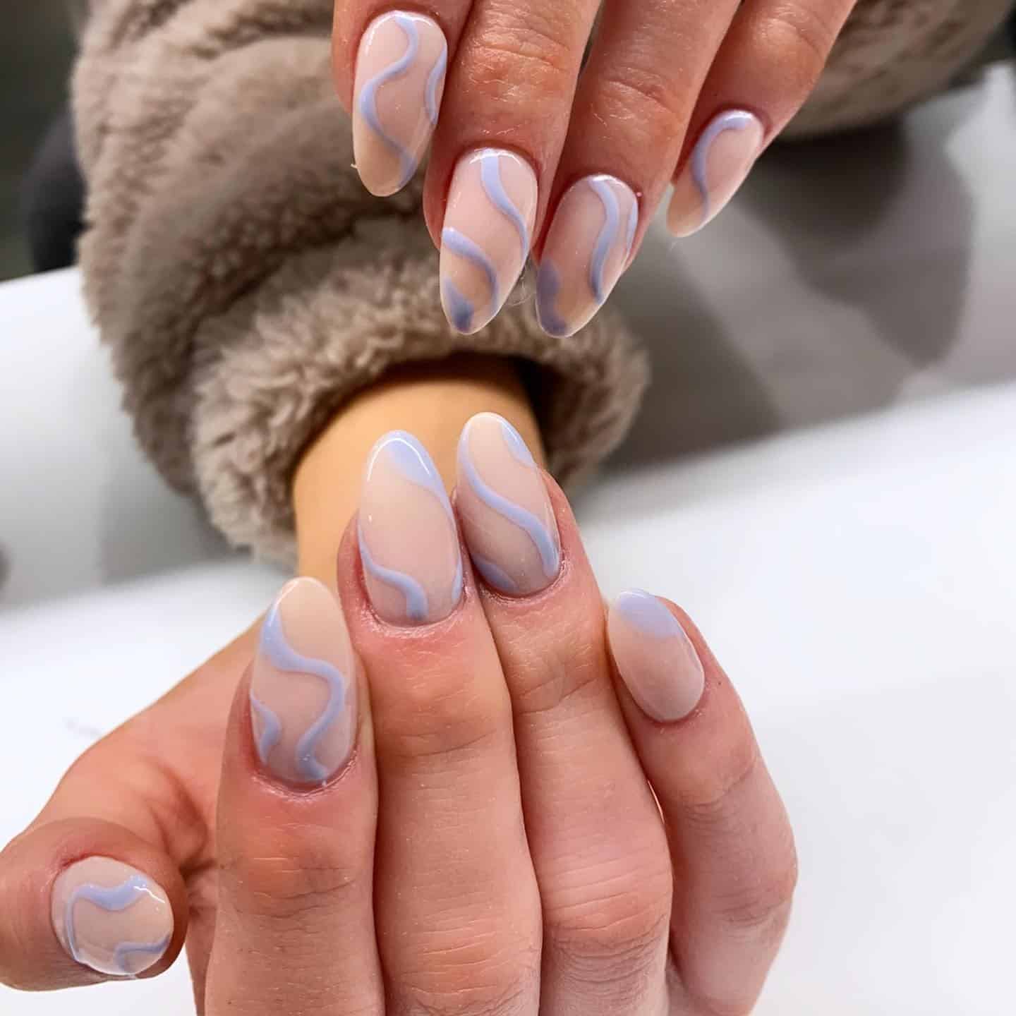 21. Soft Blue Squiggles on Sheer Almond Nails - squiggly nail ideas