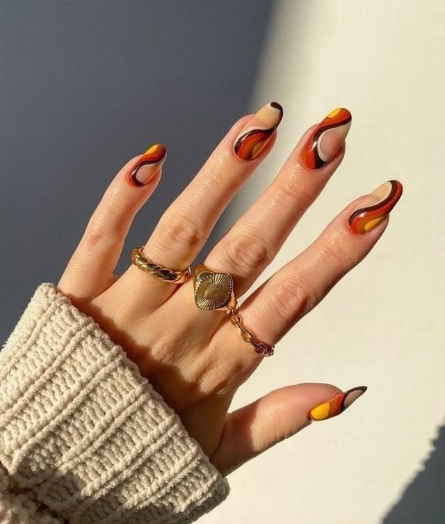 22. Sunset Swirl Almond Nails in Red, Mustard, and Black - squiggly nail ideas