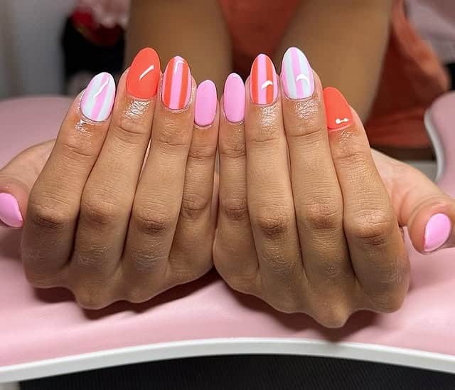 3. Pink & Coral Vertical Accent Stripes - striped nail ideas