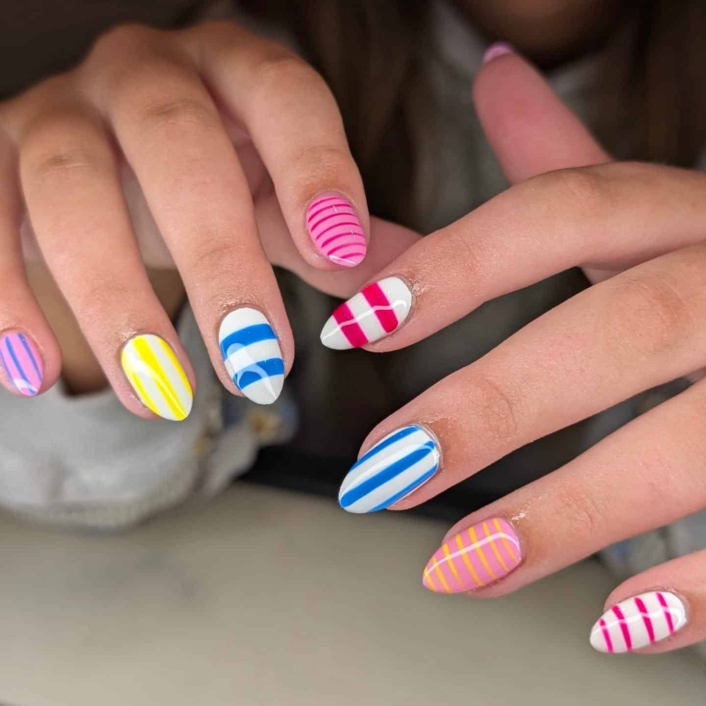 6. Vibrant Multicolor Stripe Combo - striped nail ideas