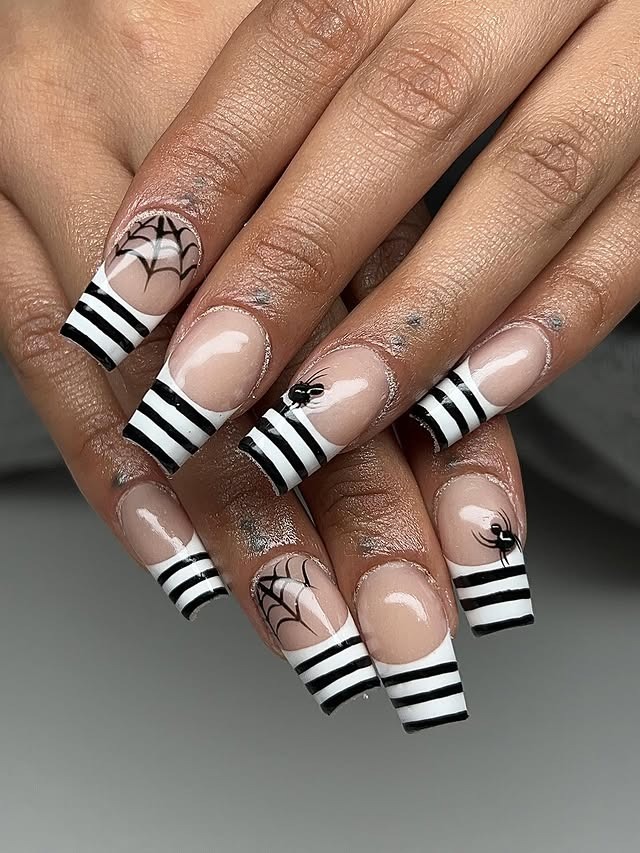 13. Striped Black & White Halloween French Tips - striped nail ideas