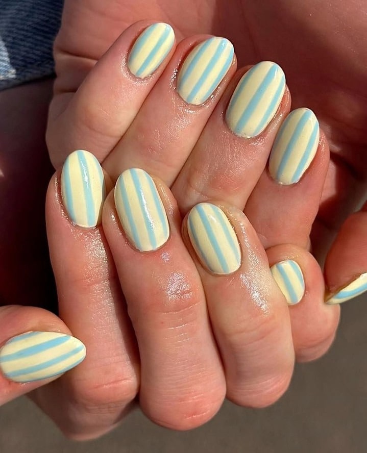 17. Pastel Sky Blue & Buttercream Stripes - striped nail ideas